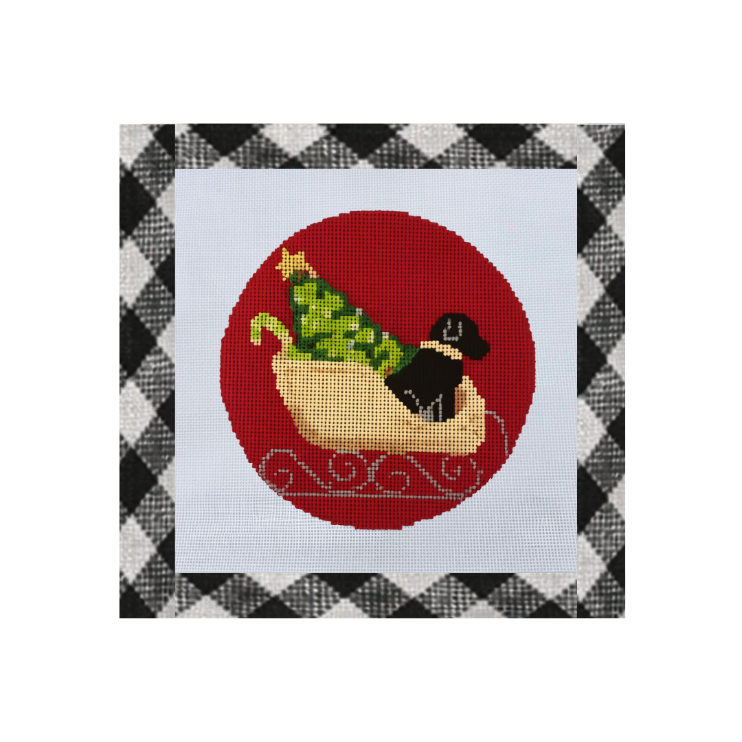 Black Lab in Sleigh with Tree